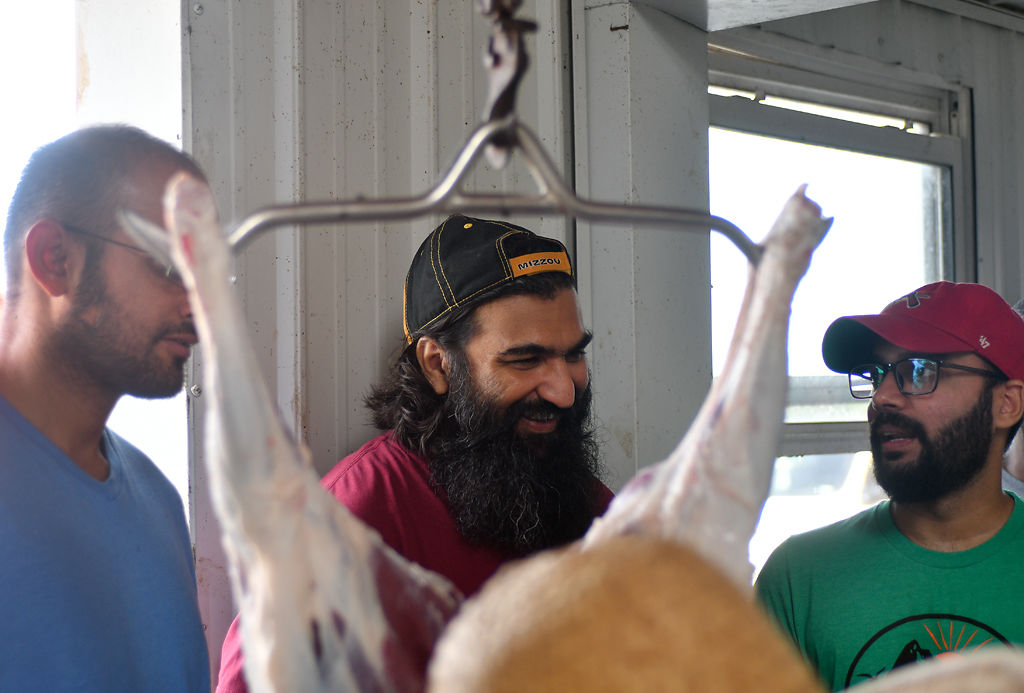 Amir Choudhry, Vakil Ahmad and Mirza Baig talk after the sacrifice